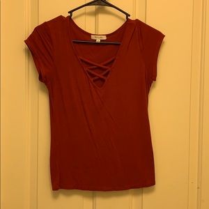 Dark orange/red tshirt. V-neck with design